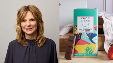 This image depicts Linda Barrie, Director of Choc Affair, alongside one of her delicious chocolates