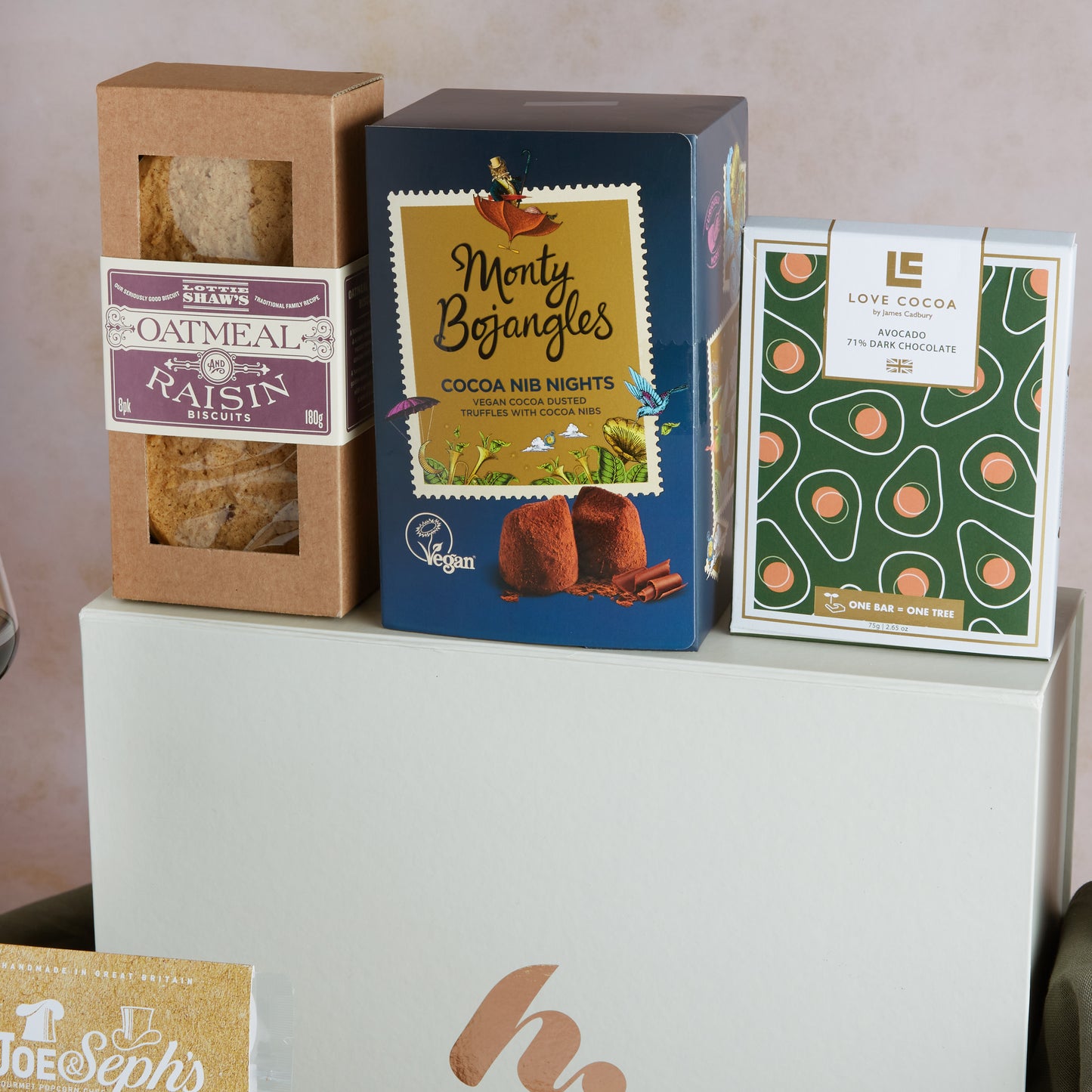 Close up of products in Red Wine & Vegan Treats Hamper, a luxury gift hamper from hampers.com UK