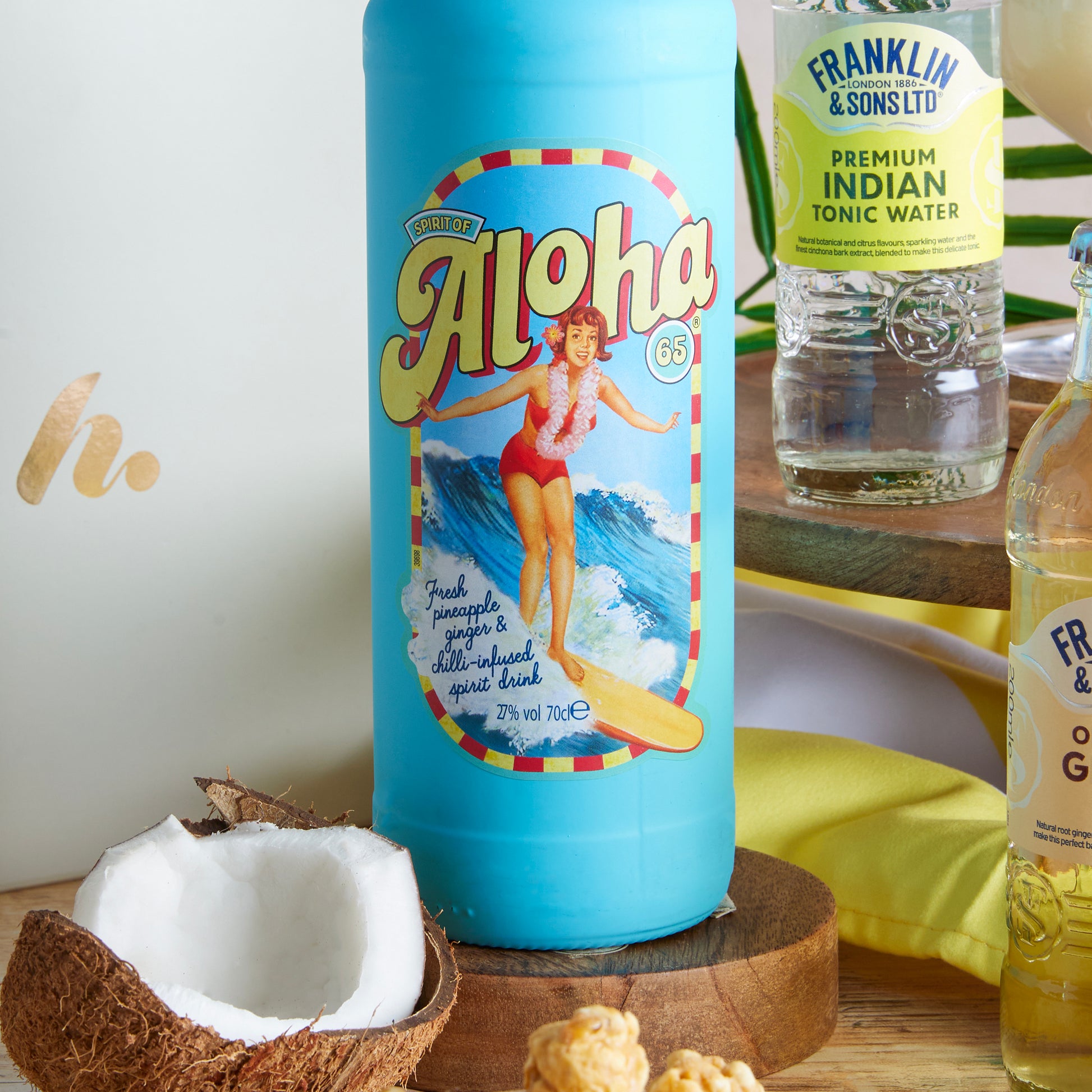 Close up of products in the Aloha Summer Cocktail Hamper, a luxury gift hamper from hampers.com UK