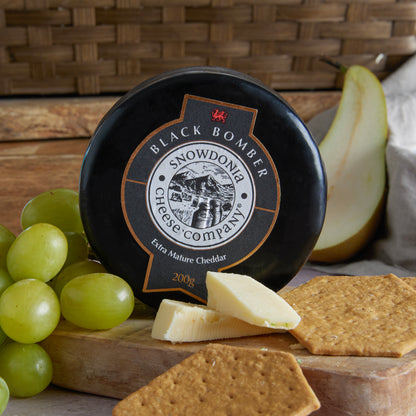 Close up of products in Luxury White Wine, Cheese & Quince Hamper, a luxury gift hamper from hampers.com UK