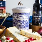 Close up of products in The Port & Stilton Christmas Gift Box, a luxury Christmas gift hamper at hampers.com UK