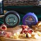 Close up of products in Christmas Eve Wine & Nibbles Gift Basket, a luxury Christmas gift hamper at hampers.com UK