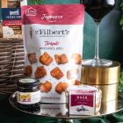 Close up of products in Christmas Eve Wine & Nibbles Gift Basket, a luxury Christmas gift hamper at hampers.com UK