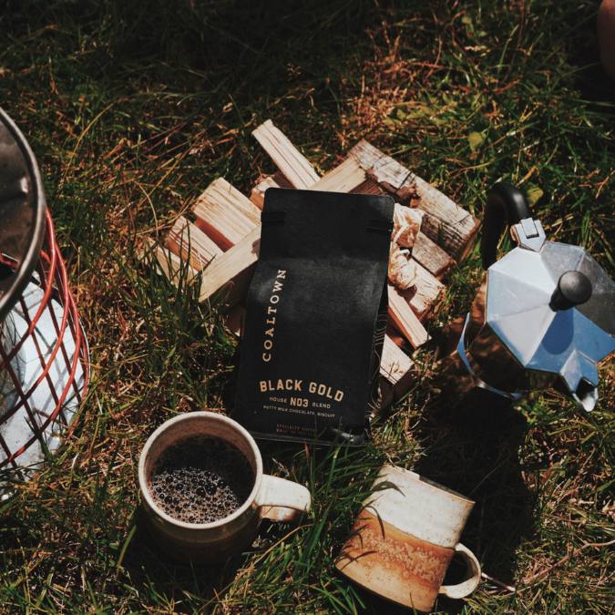 Collection of mugs, firewood and Coaltown coffee