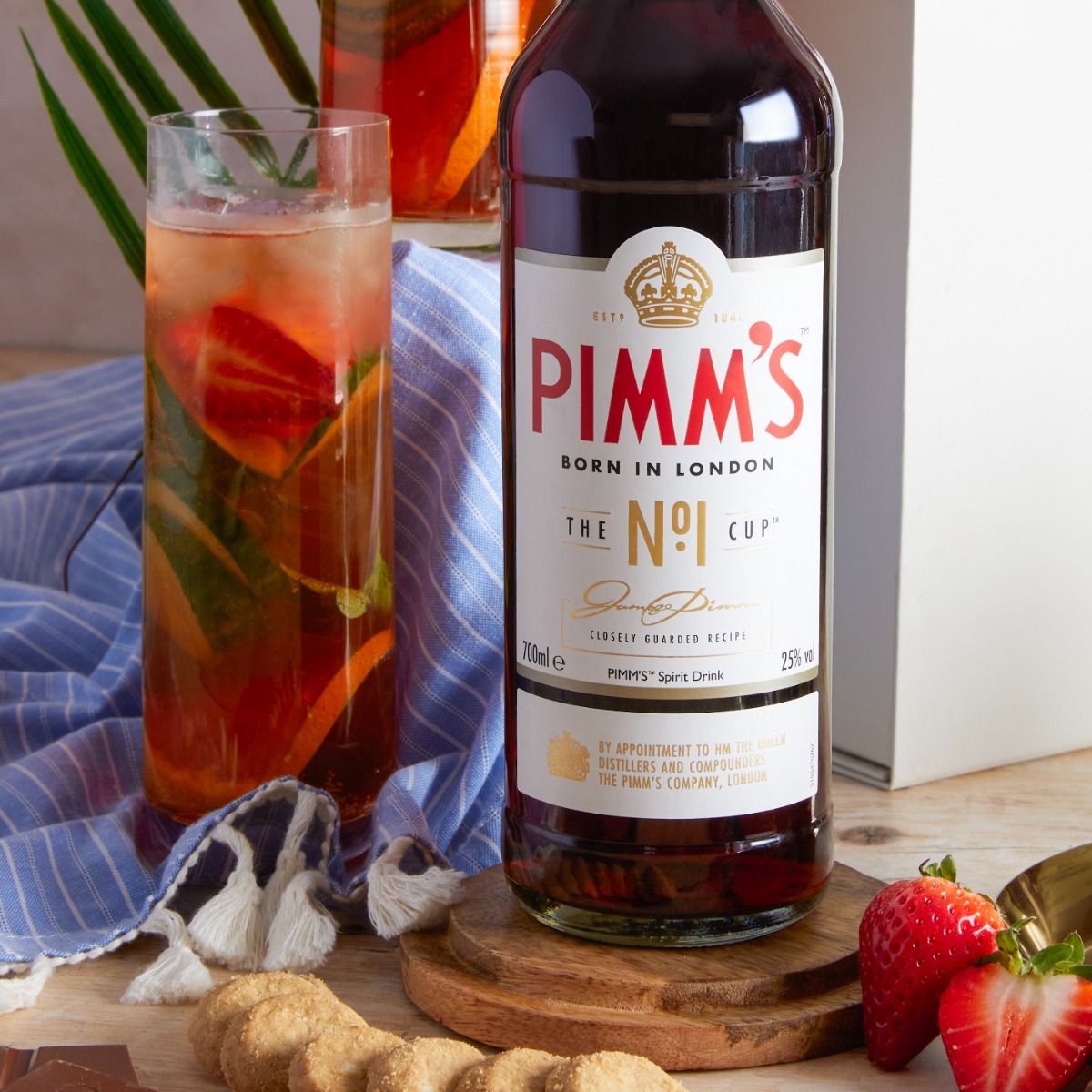 close up of Pimm's bottle and glass, in the British Pimm's Summer Hamper
