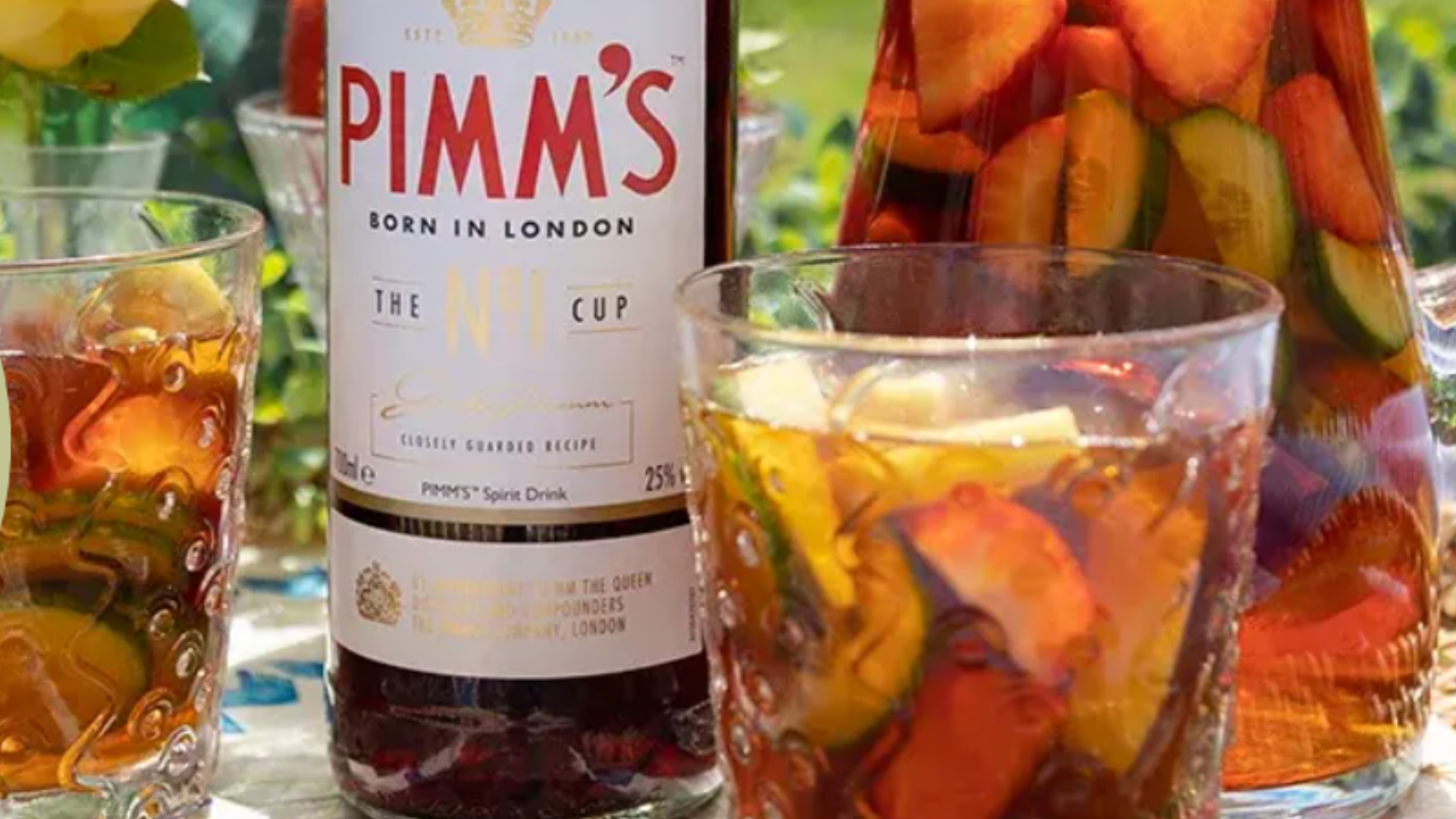 Bottle of Pimms, Pimms in a jug and glasses of Pimms