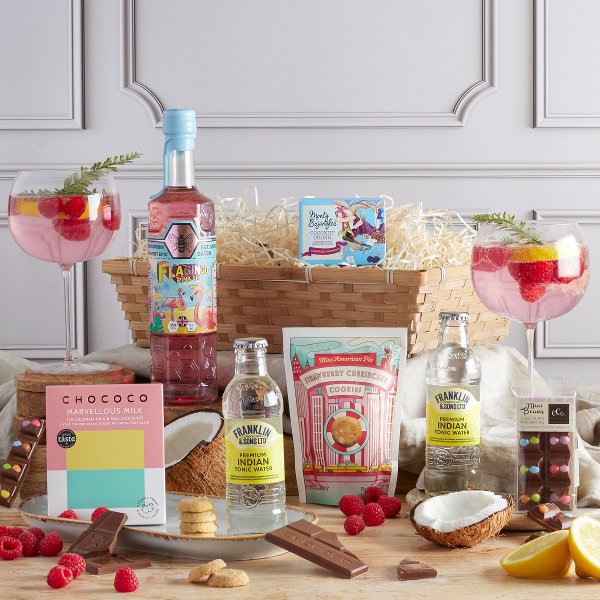 Flagingo Pink Gin Hamper with contents on display as a recommended Christmas gift for her