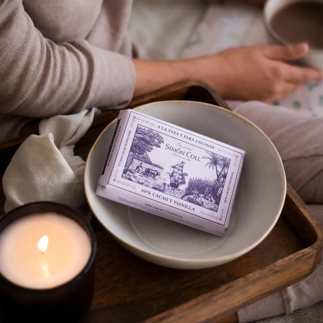 Drinking Chocolate Bar by Simón Coll in a bowl on a tray with a candle