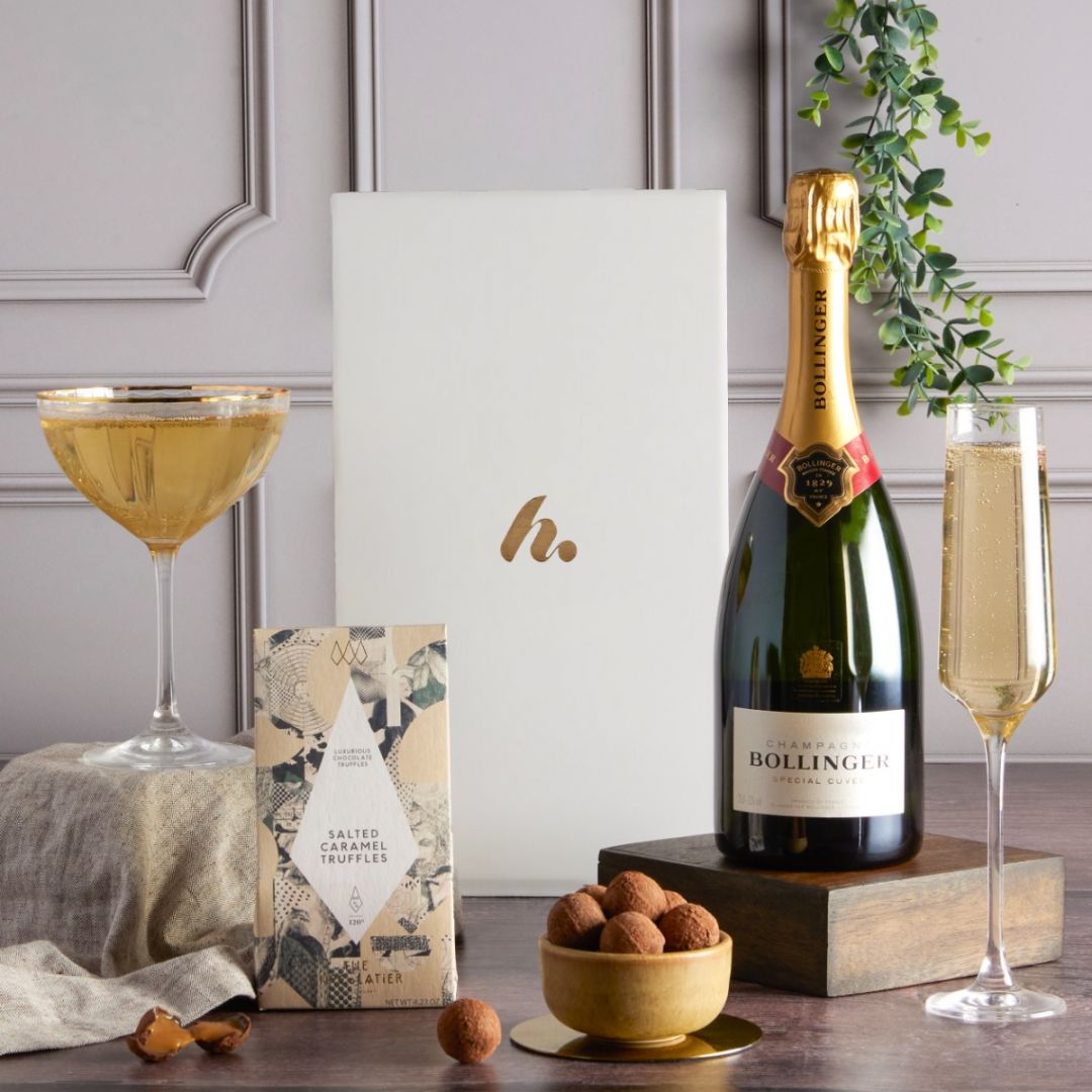 Flatlay of Champagne and chocolate from the Prosecco and Champagne Hampers banner