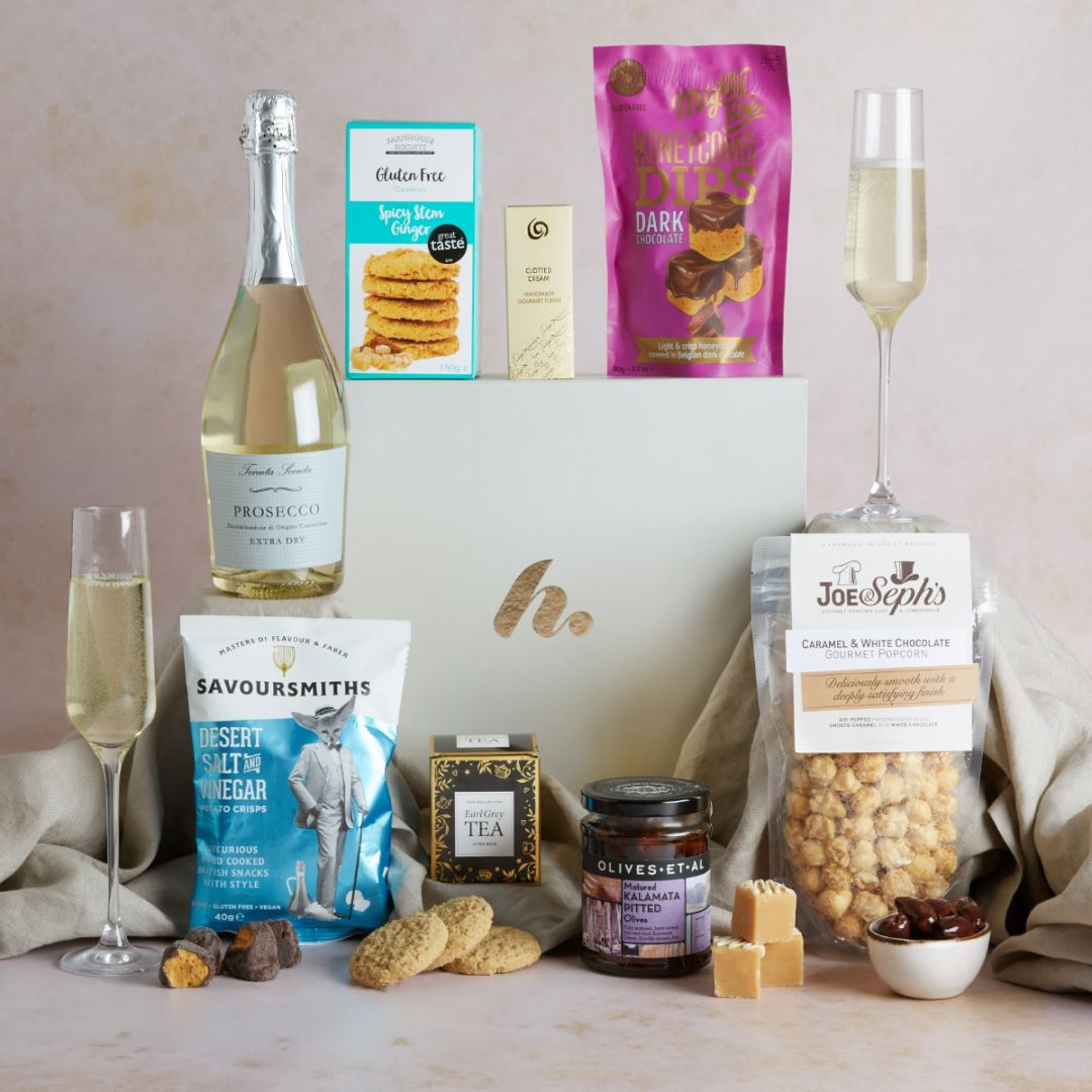 Gluten Free Delights Hamper with Prosecco with contents on display as a recommended teacher gift